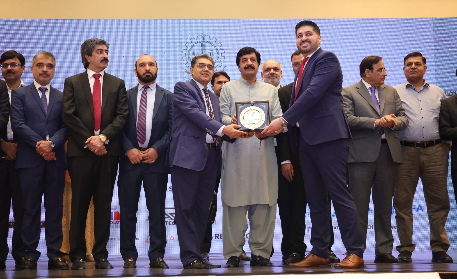 Shehryar T. Ali receiving a shield at the 2025 presentation by the Governor of Punjab.