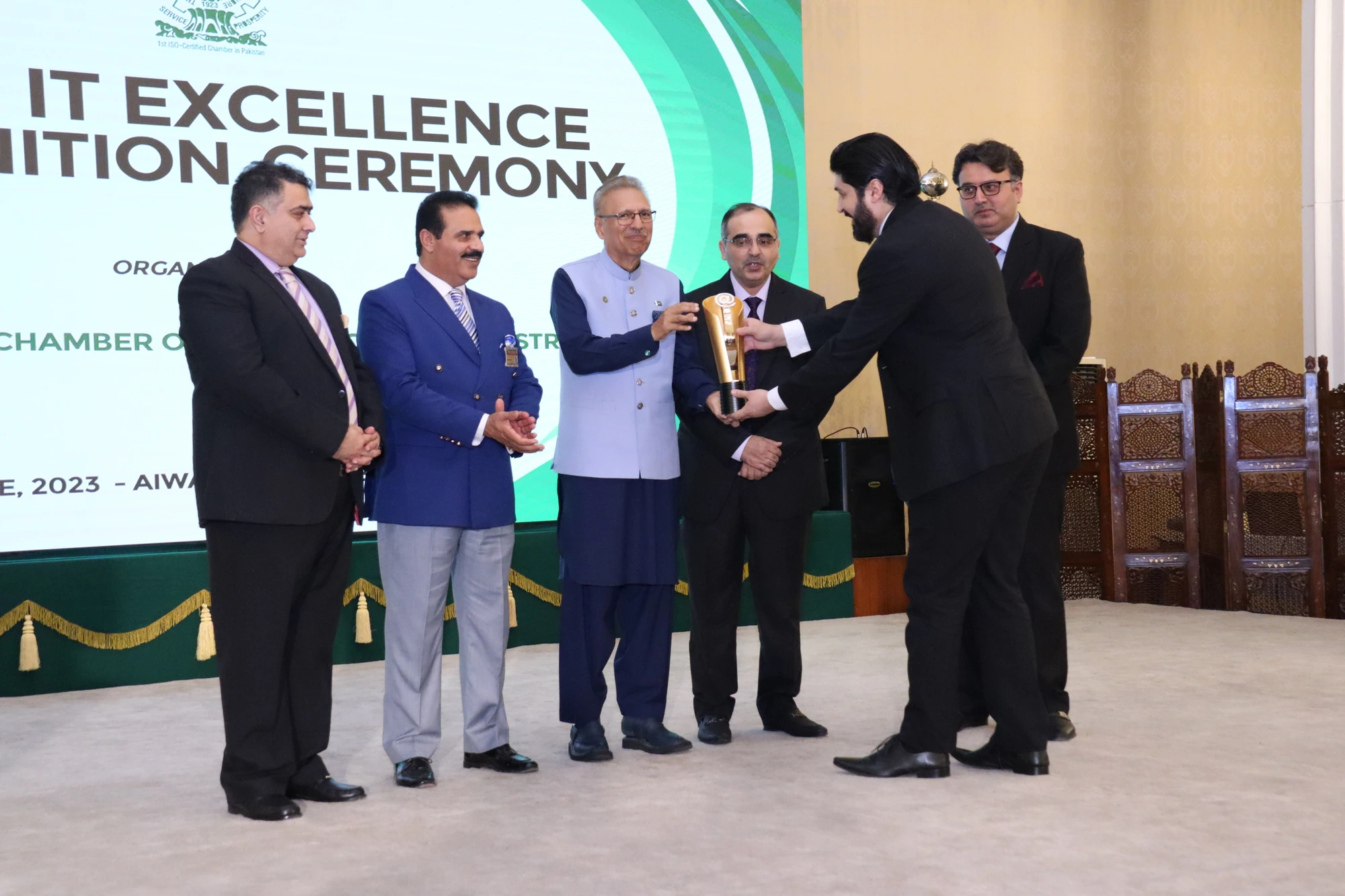 Shehryar T. Ali receiving the Best IT Services Award from President Dr. Arif Alvi on 6 June 2023.
